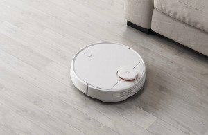 Battle for cleanliness: who better to clean - a man or a robot vacuum cleaner?